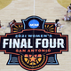 Stanford celebrates their victory while a dejected Aari McDonald of Arizona sits on the court after the Cardinals won the women’s national championship on Sunday.